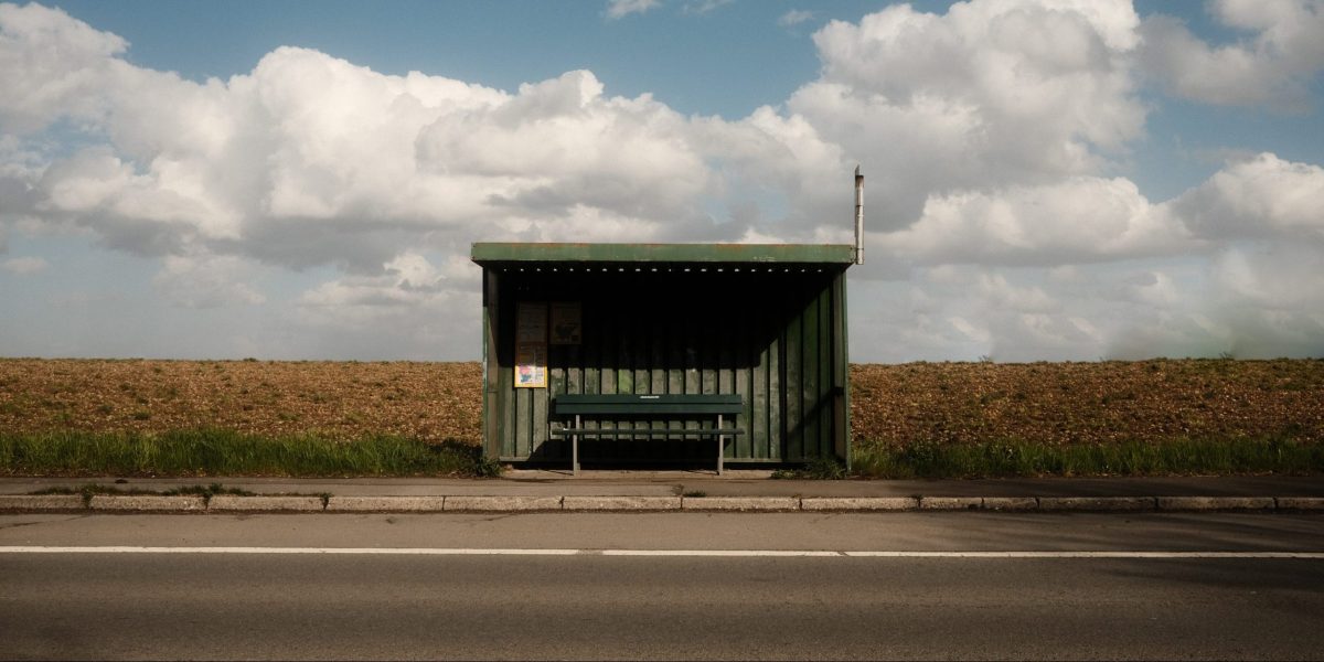 empty bus stop symbolising waiting