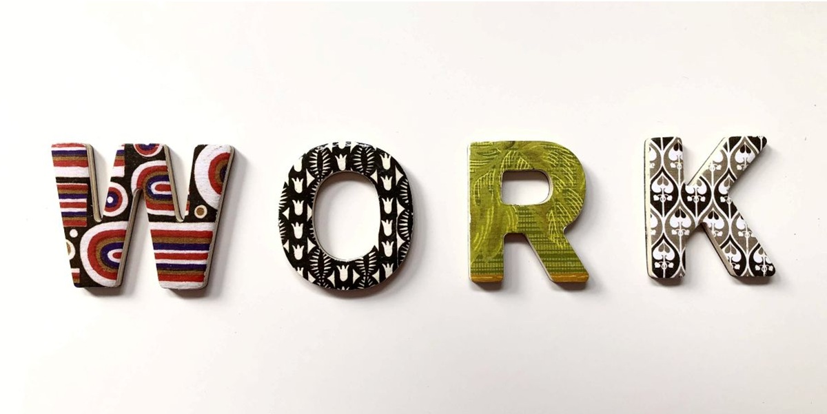 Four coloured letters spelling Work. Each of them different illustrating this article about leadership coaching which focusses on the multifaceted experience of the leadership coach